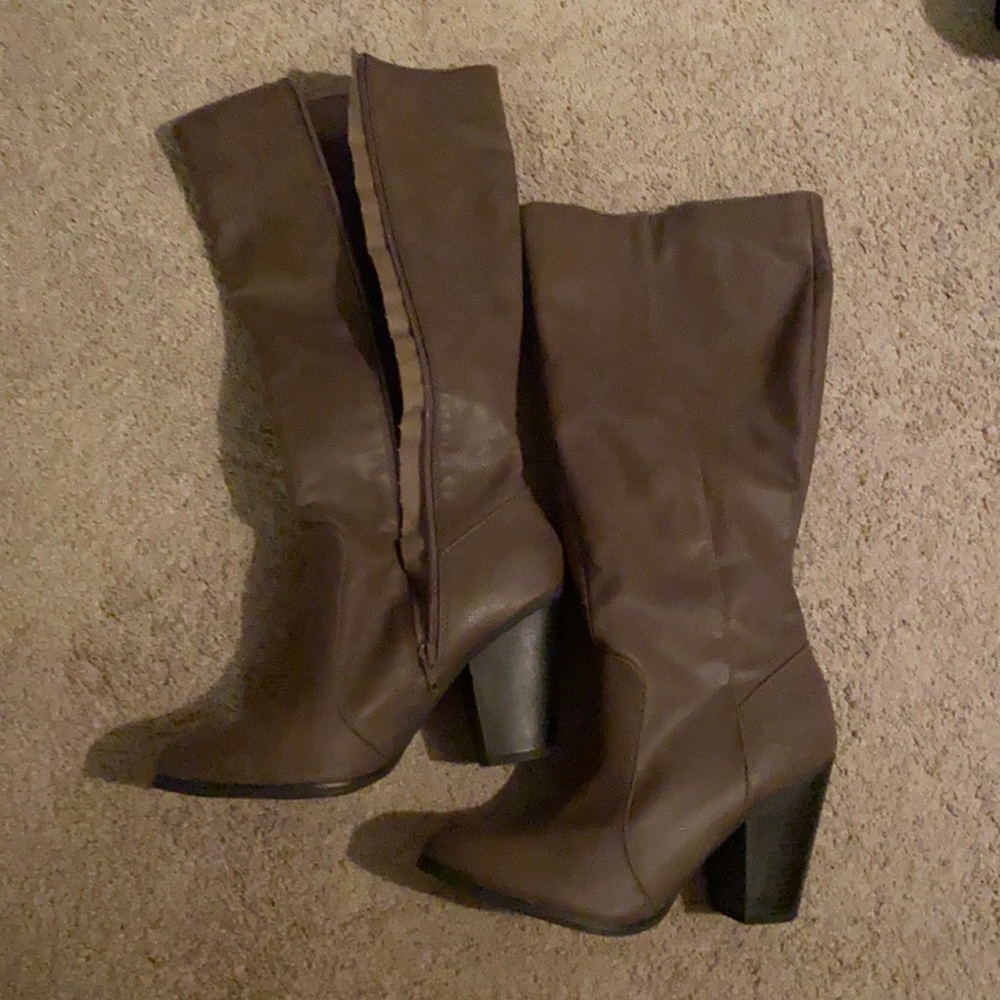 Grayish brown tall zip up heeled boots.